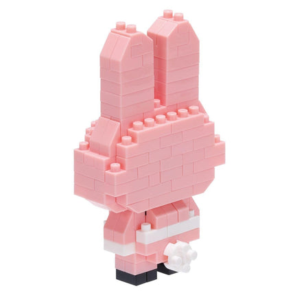 A pink, brick-like toy figure made of small, pink building blocks.