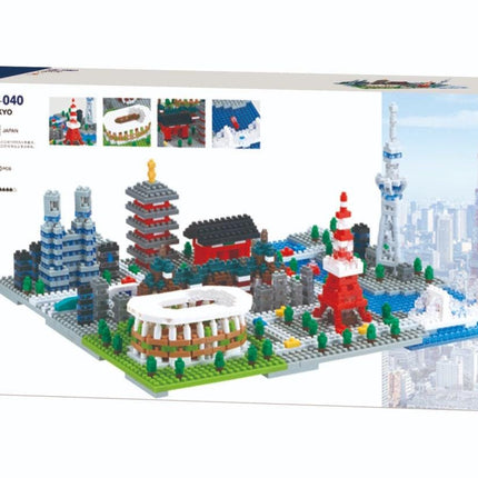 The image is a box containing a model kit of various buildings and structures, including a tower, a stadium, and other landmarks, set against a backdrop of a city skyline.