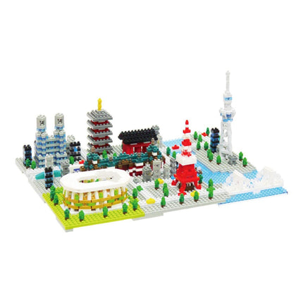 A colorful and intricate model of a cityscape made up of various building blocks and structures, including a tower, a pagoda, and a stadium.