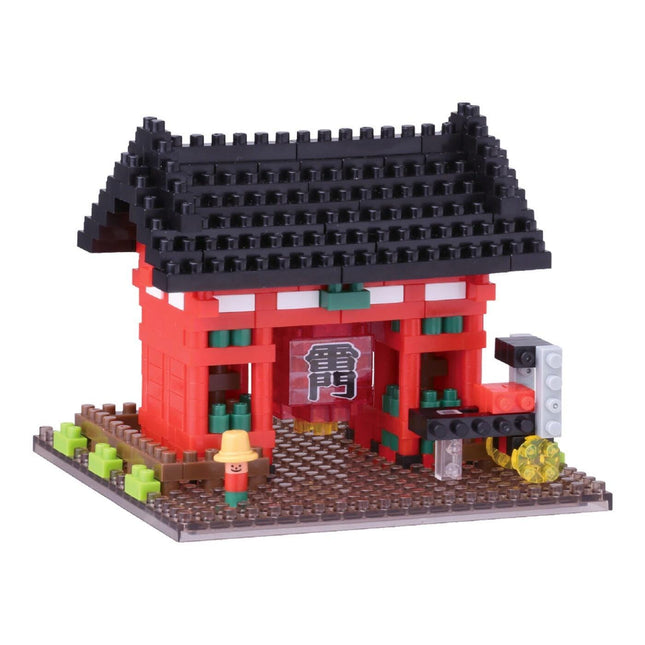 A colorful toy model of a traditional Japanese temple made of building blocks, featuring a red roof and a black roof.
