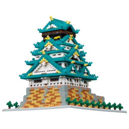 A colorful, intricate model of a traditional Japanese castle or pagoda, composed of numerous small, interlocking bricks in various shades of blue, green, and yellow.