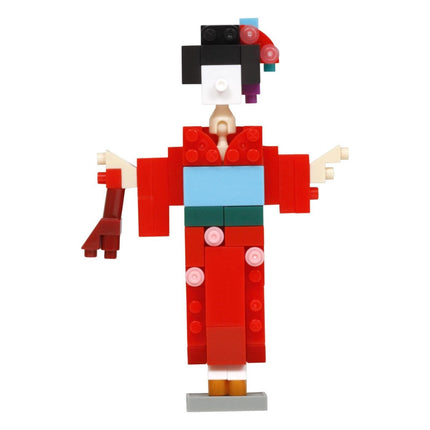 A colorful and whimsical toy figure made of various building blocks, resembling a geisha or a traditional Japanese character.