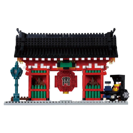 A colorful, traditional Japanese-style gate with a red roof and black accents, surrounded by a train and other elements, all made of building blocks.