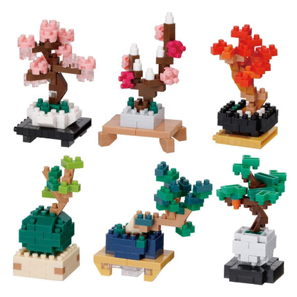 six different tree-like structures made of building blocks, each with unique colors and designs.