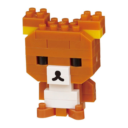A small orange and white toy resembling a bear or a similar animal character.