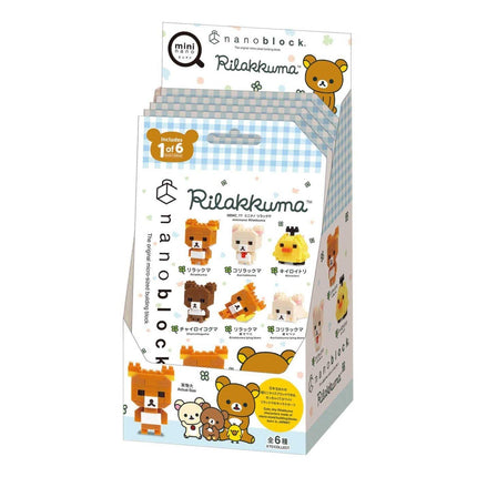 A box containing a collection of various cartoon animal figurines, including bears, chickens, and other cute characters.