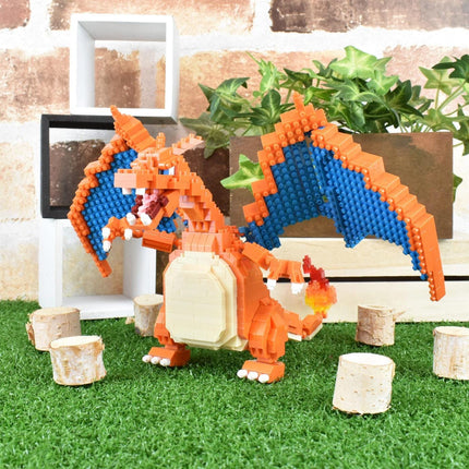 A LEGO CHAIWAN dragon figurine is posed on a grassy surface, surrounded by small tree stump decorations.