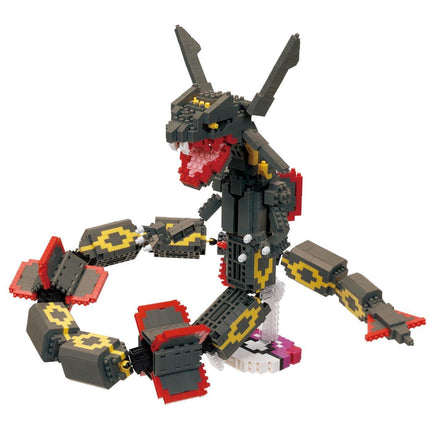 A LEGO snake toy with a red mouth and yellow and black patterned body.