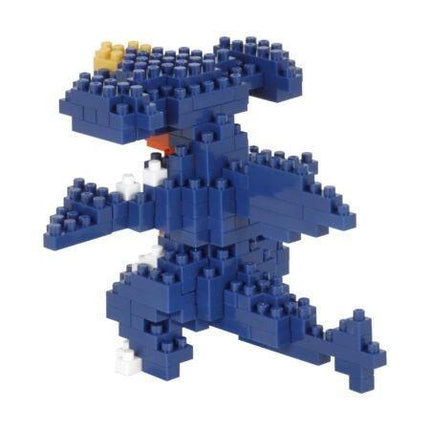 A blue LEGO dinosaur-shaped building made up of numerous small LEGO bricks.