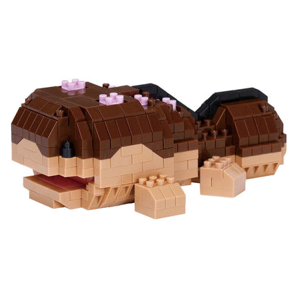 A brown and tan Lego toy resembling a small fish or sea creature, with a large head and smaller fins.