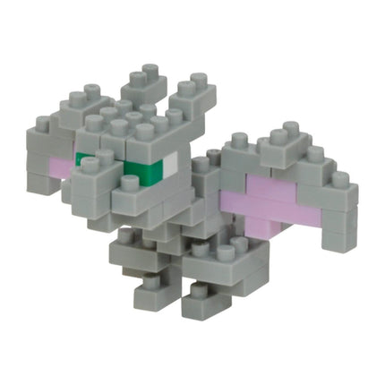 A gray LEGO brick figure with green eyes and pink wings.