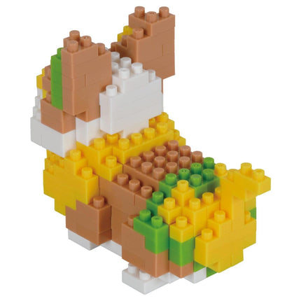 A colorful and intricate toy made of various building blocks in different shapes and colors, including yellow, green, and brown.