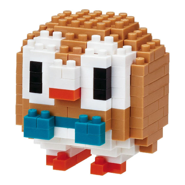 A pixelated toy resembling a small owl or penguin made of building blocks in various colors.