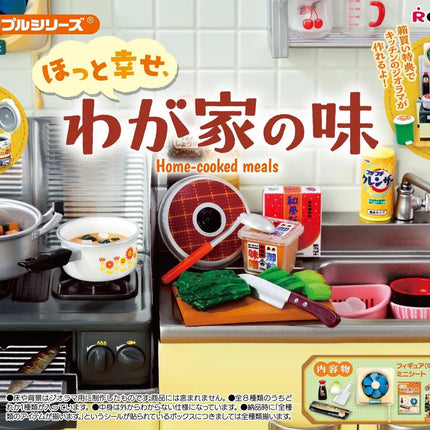The image is an advertisement for a toy kitchen set, featuring various kitchen appliances and accessories such as pots, pans, a sink, and a cutting board.