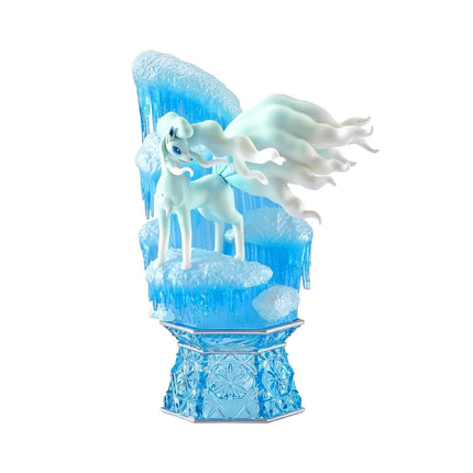 A figurine of a white unicorn standing on a blue pedestal with ice and snow elements.
