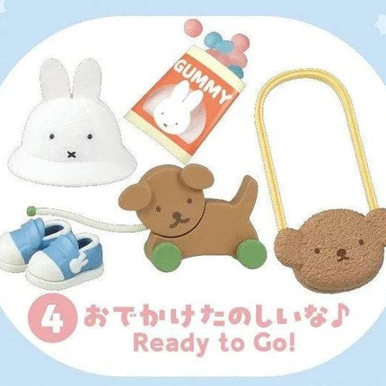 various cute animal toys and a gummy bear, along with a pair of shoes and a teddy bear.