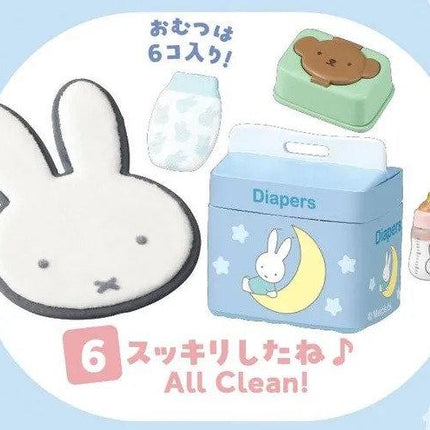 various baby-related items, including a white bunny head, a blue diaper box, a green and white baby bottle, and a brown bear-shaped container. The text "6 ビールです" (Six diapers) and "All Clean!" (All clean) is visible, along with a pink square with the number "6" and a pink square with the number "1" below it.