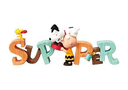 A figurine of a character holding a bird and a can, with the word "SUPPER" spelled out in large letters.