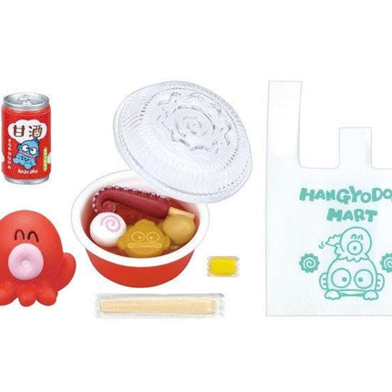 various items, including a can of soda, a bowl of food, a toy, a plastic bag, and a toy with a face.