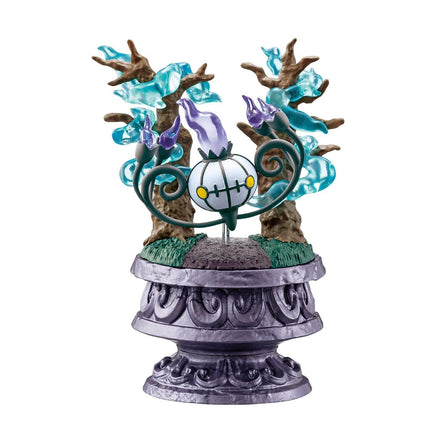 A figurine of a character with a glowing white head and a purple body, surrounded by a whimsical, fantastical scene with trees, flowers, and other fantastical elements.