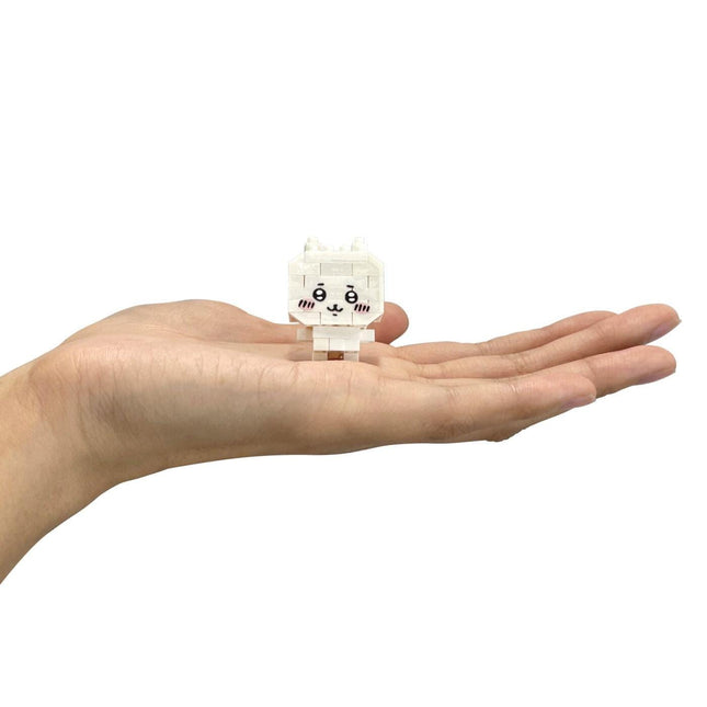Mini Chiikawa nanoblock figure held on an open hand