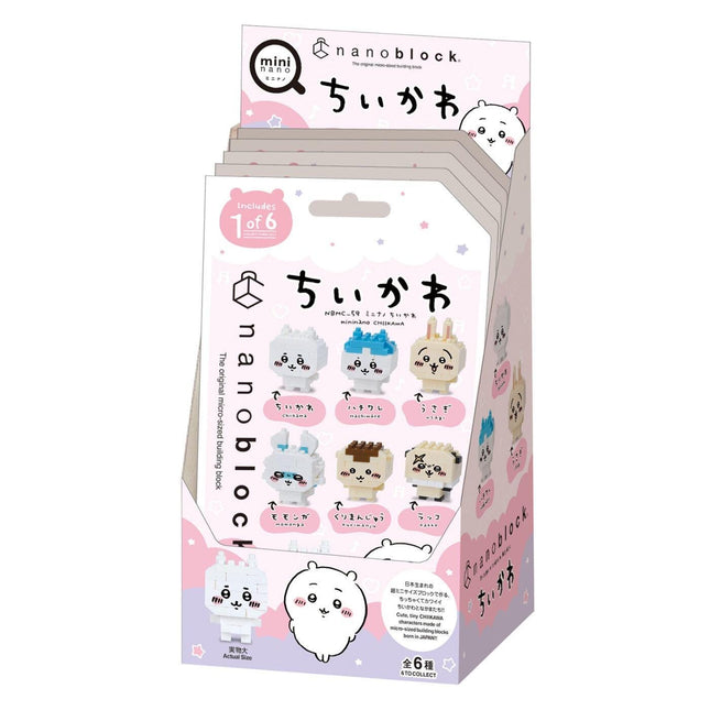A pink and white box containing a collection of six cute, cartoon-like character figurines, likely representing a product or theme related to the characters.