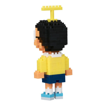 A pixelated figure of a person wearing a yellow shirt and blue shorts, with a yellow crown on their head.