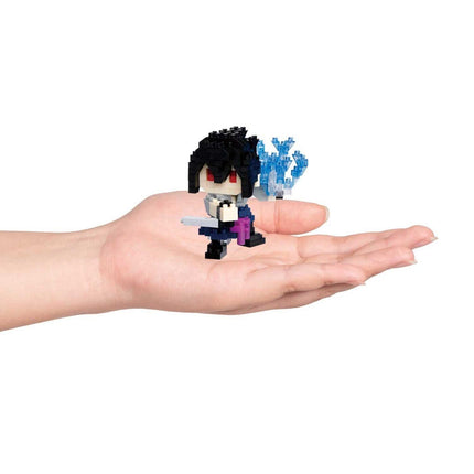 A hand holding a small, pixelated character in a stylized pose.