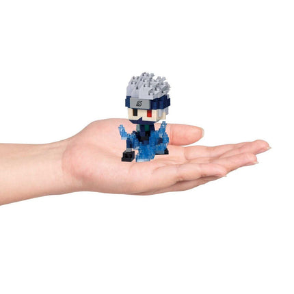A hand holding a small, colorful, and detailed figurine of a character from a video game.