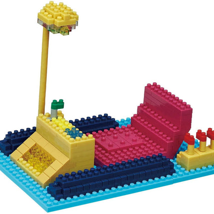 A colorful toy construction set made of various building blocks in different shapes and colors, including a yellow and blue base, a pink and red structure, and a yellow and red structure.