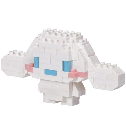A white, pixelated character made of small white blocks, resembling a pixelated doll or a pixelated animal.