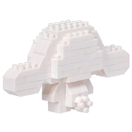 A white, three-dimensional object composed of numerous small white blocks, resembling a geometric or abstract structure.