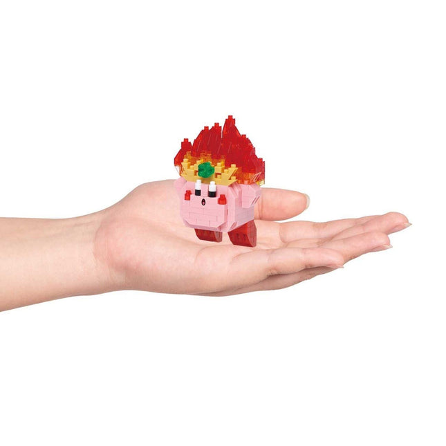A hand holding a small pink and red pixelated character with a green eye and red hair.
