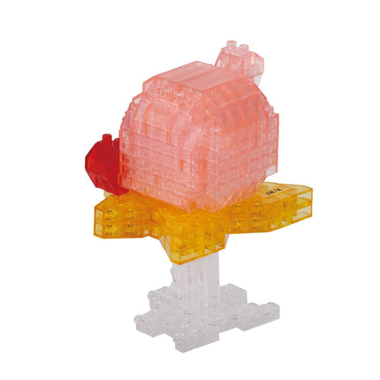 A pink and yellow 3D model of a building or structure, composed of numerous small plastic blocks.