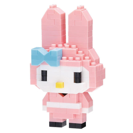 A pink and white Hello Kitty-style building block figure with a yellow button on its face.