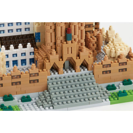 A detailed 3D model of a castle made of Lego bricks, showcasing intricate architectural details and a complex structure.