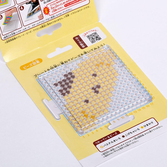 DIY Perler beads set with Pompompurin bead template on clear pegboard