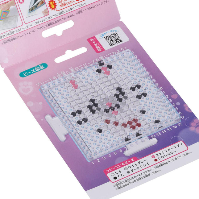 a pink and purple packaging for a product, likely a craft or art supply. The packaging features a grid-like pattern and includes some text in Japanese.