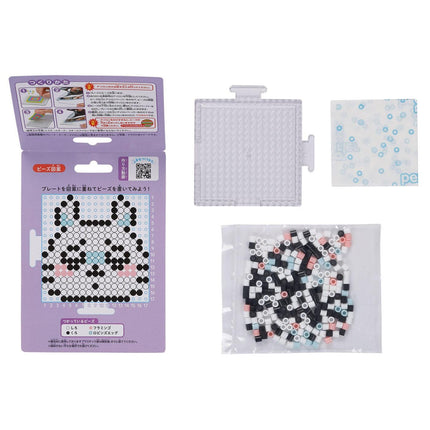 a package of a pixel art design kit, a clear plastic container, and a bag filled with colorful beads.