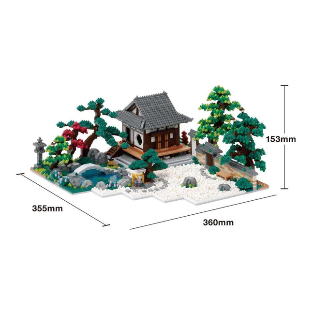 A detailed model of a Japanese-style house surrounded by a garden, including a pond, trees, and other landscaping elements.