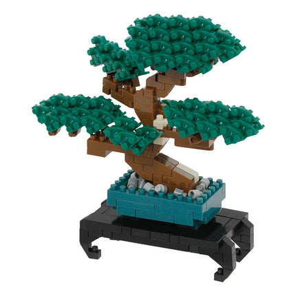 A Lego bonsai tree made of green and brown Lego bricks, placed on a black Lego base.