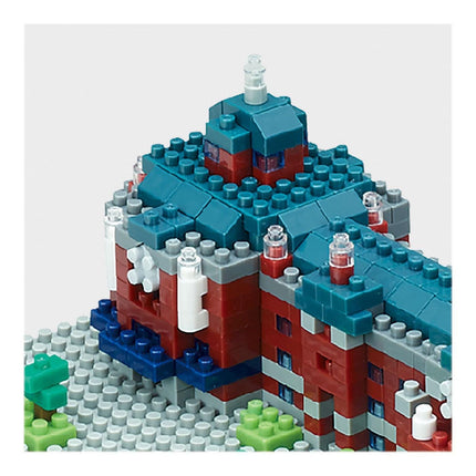 A colorful and intricate Lego model of a building, composed of various colored bricks and pieces.