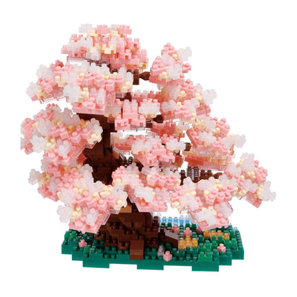 A pink and white Lego tree made up of numerous small Lego bricks, creating a detailed and intricate floral structure.
