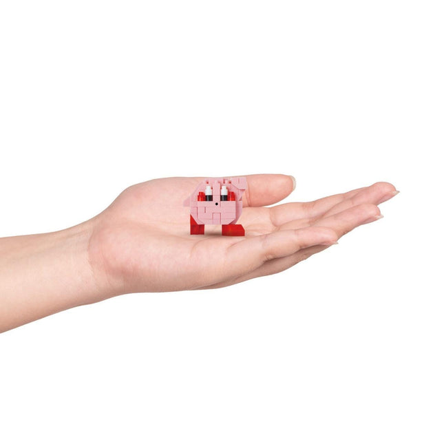 A hand holding a small pink and red toy, which appears to be a small, colorful object.