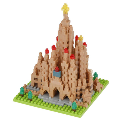 A small, colorful, and intricate model of a castle-like structure made of small, beige-colored building blocks.