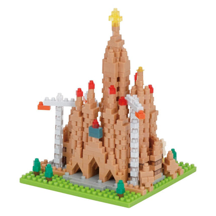 A colorful, three-dimensional model of a castle-like structure made up of small, beige-colored building blocks.