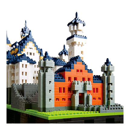 A colorful and intricate model of a castle made of building blocks, showcasing various architectural elements such as towers, turrets, and arches.