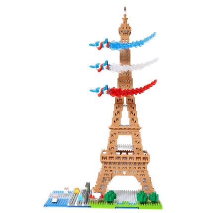 A colorful and whimsical tower made of building blocks, featuring a variety of shapes and colors, including red, white, and blue.