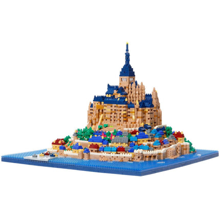 A detailed and colorful model of a castle or palace, constructed from small building blocks, set against a blue background.