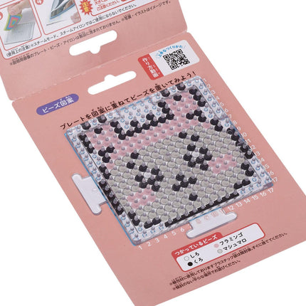 a pink packaging for a product, likely a craft or art supply, with a clear and detailed view of the product itself.